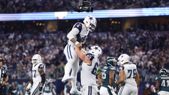 Dec 10, 2023; Arlington, Texas, USA; Dallas Cowboys quarterback Dak Prescott (4) celebrates a touchdown with Dallas Cowboys center Tyler Biadasz (63) in the second quarter at AT&T Stadium.