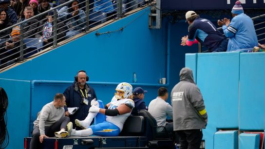Los Angeles Chargers offensive tackle Joe Alt (76) is carted off after an injury during the second quarter against the Tennessee Titans at Nissan Stadium in Nashville, Tenn., Sunday, Nov. 2, 2025.