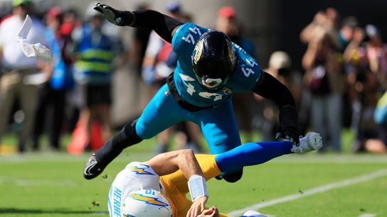 Jacksonville Jaguars defensive end Travon Walker (44) hurries Los Angeles Chargers quarterback Justin Herbert (10) as he is called for intentional grounding during the first quarter of an NFL football game at EverBank Stadium, Sunday, Nov. 16, 2025 in Jacksonville, Fla. 