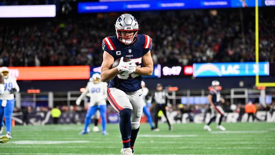 Jan 11, 2026; Foxborough, MA, USA; New England Patriots tight end Hunter Henry (85) scores a touchdown during the fourth quarter against the Los Angeles Chargers in an AFC Wild Card Round game at Gillette Stadium.