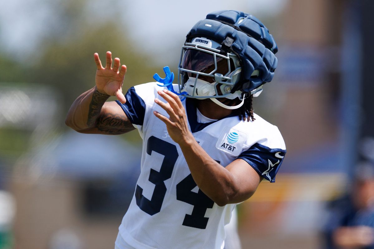 Jaydon Blue #34 of the Dallas Cowboys catches the ball during training camp practice at Staybridge Suites Oxnard on July 21, 2025 in Oxnard, California. 
