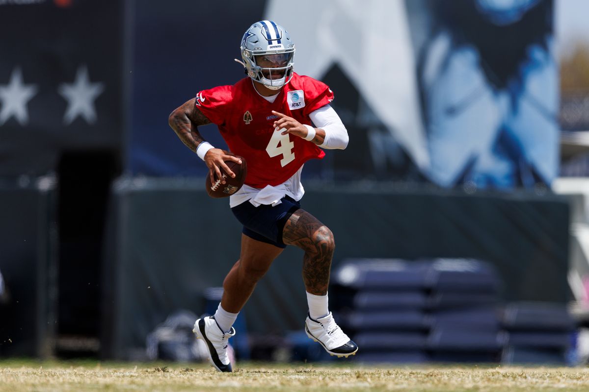 Dak Prescott #4 of the Dallas Cowboys runs with the ball during training camp practice at Staybridge Suites Oxnard on July 21, 2025 in Oxnard, California. 