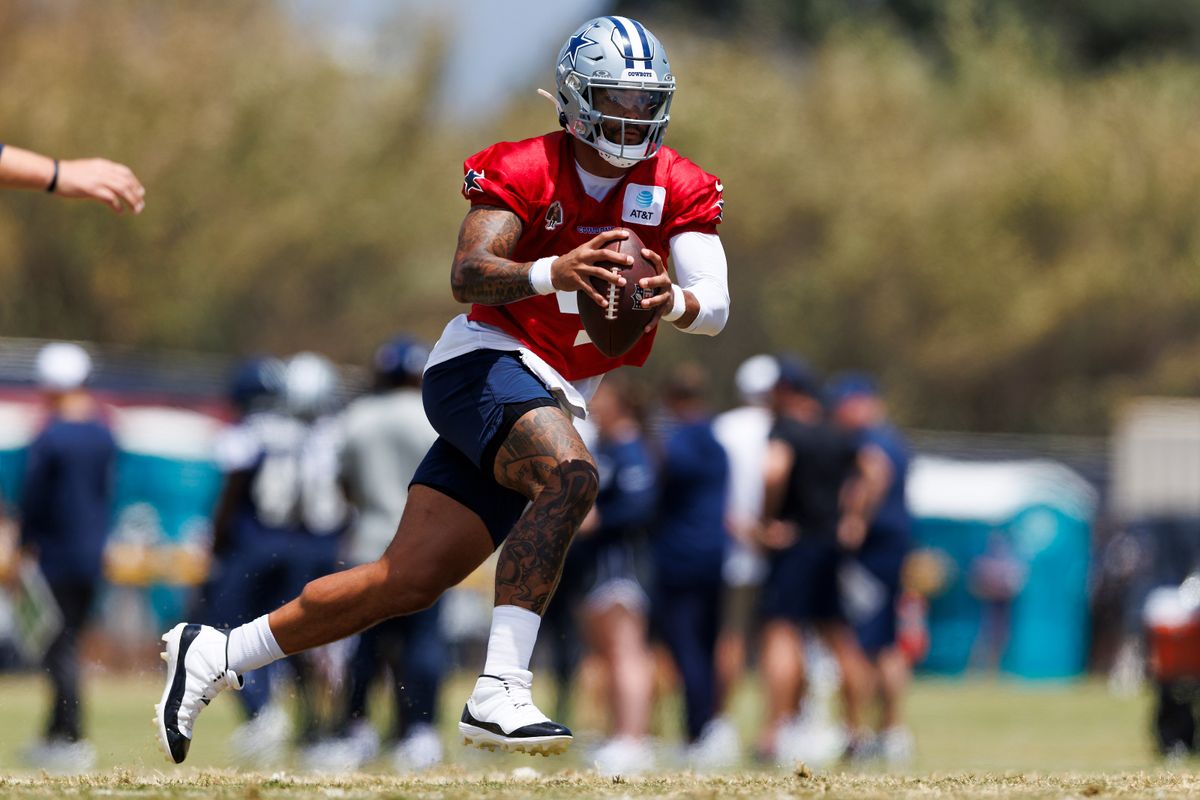 Dak Prescott #4 of the Dallas Cowboys runs with the ball during training camp practice at Staybridge Suites Oxnard on July 21, 2025 in Oxnard, California. 