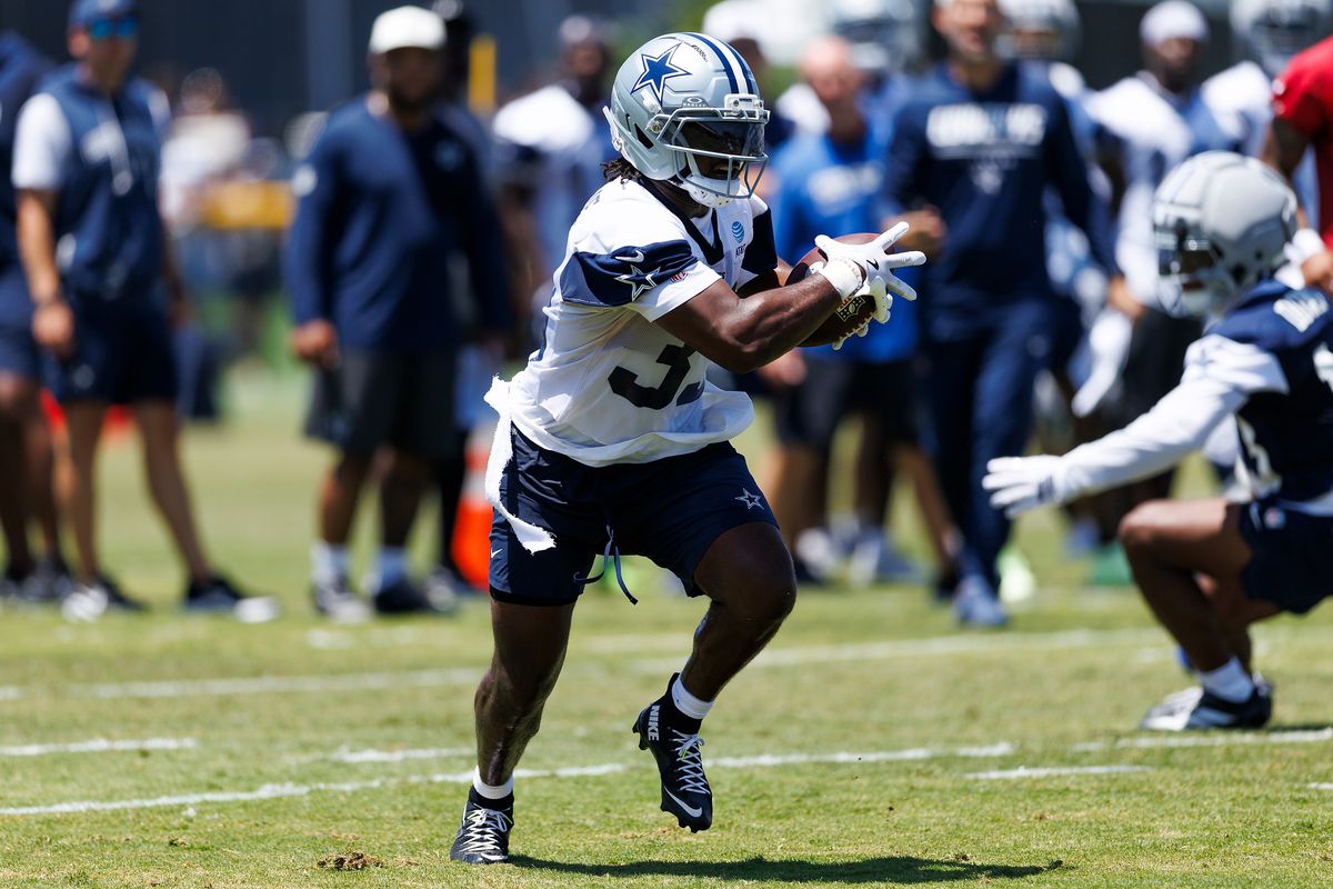 Javonte Williams #33 of the Dallas Cowboys runs with the ball during training camp at River Ridge Playing Fields on July 30, 2026 in Oxnard, California.