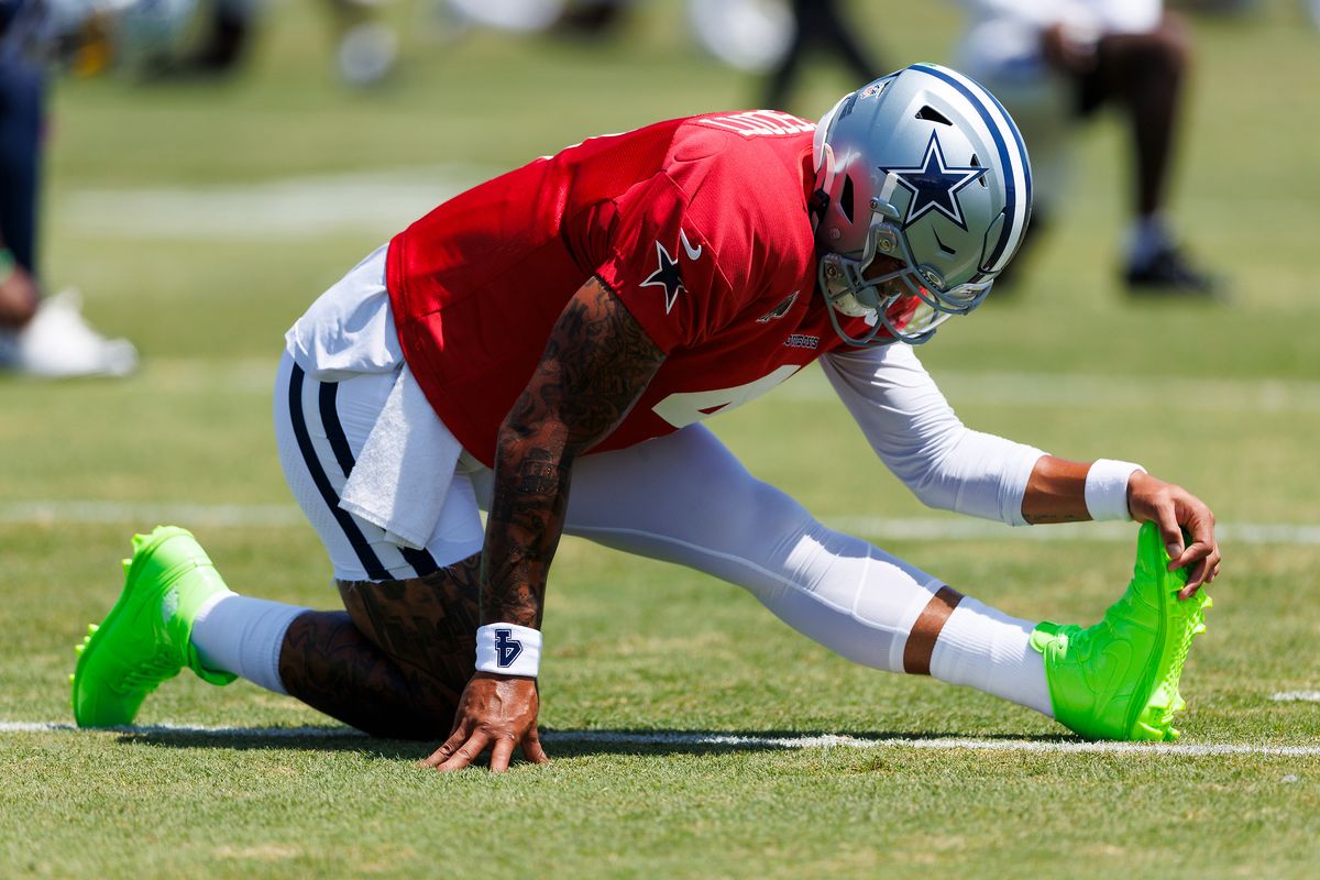 Dak Prescott #4 of the Dallas Cowboys stretches during training camp at River Ridge Playing Fields on August 4, 2026 in Oxnard, California. Dak Prescott #4 of the Dallas Cowboys stretches during training camp at River Ridge Playing Fields on August 4, 2026 in Oxnard, California.