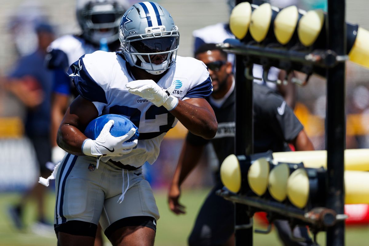 Javonte Williams #33 of the Dallas Cowboys runs with the ball during training camp at River Ridge Playing Fields on August 4, 2026 in Oxnard, California. Javonte Williams #33 of the Dallas Cowboys runs with the ball during training camp at River Ridge Playing Fields on August 4, 2026 in Oxnard, California.