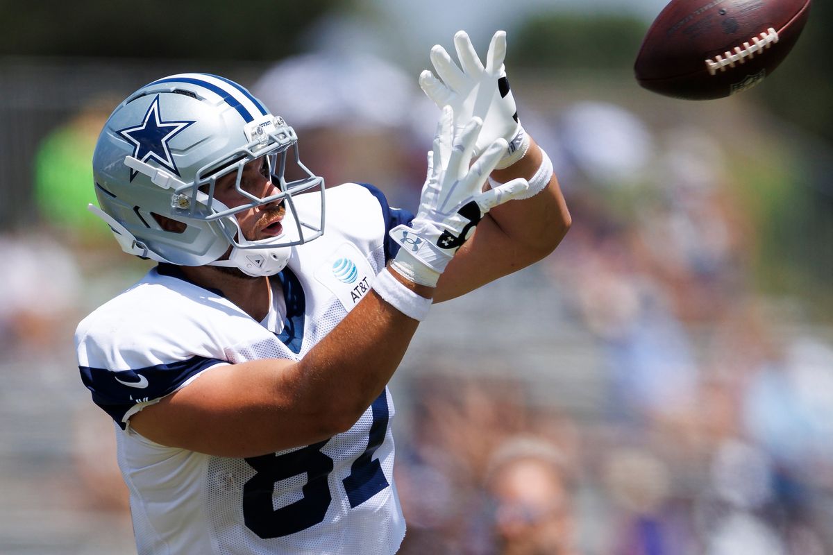 Jake Ferguson #87 of the Dallas Cowboys catches the ball during training camp at River Ridge Playing Fields on August 4, 2026 in Oxnard, California. Jake Ferguson #87 of the Dallas Cowboys catches the ball during training camp at River Ridge Playing Fields on August 4, 2026 in Oxnard, California.