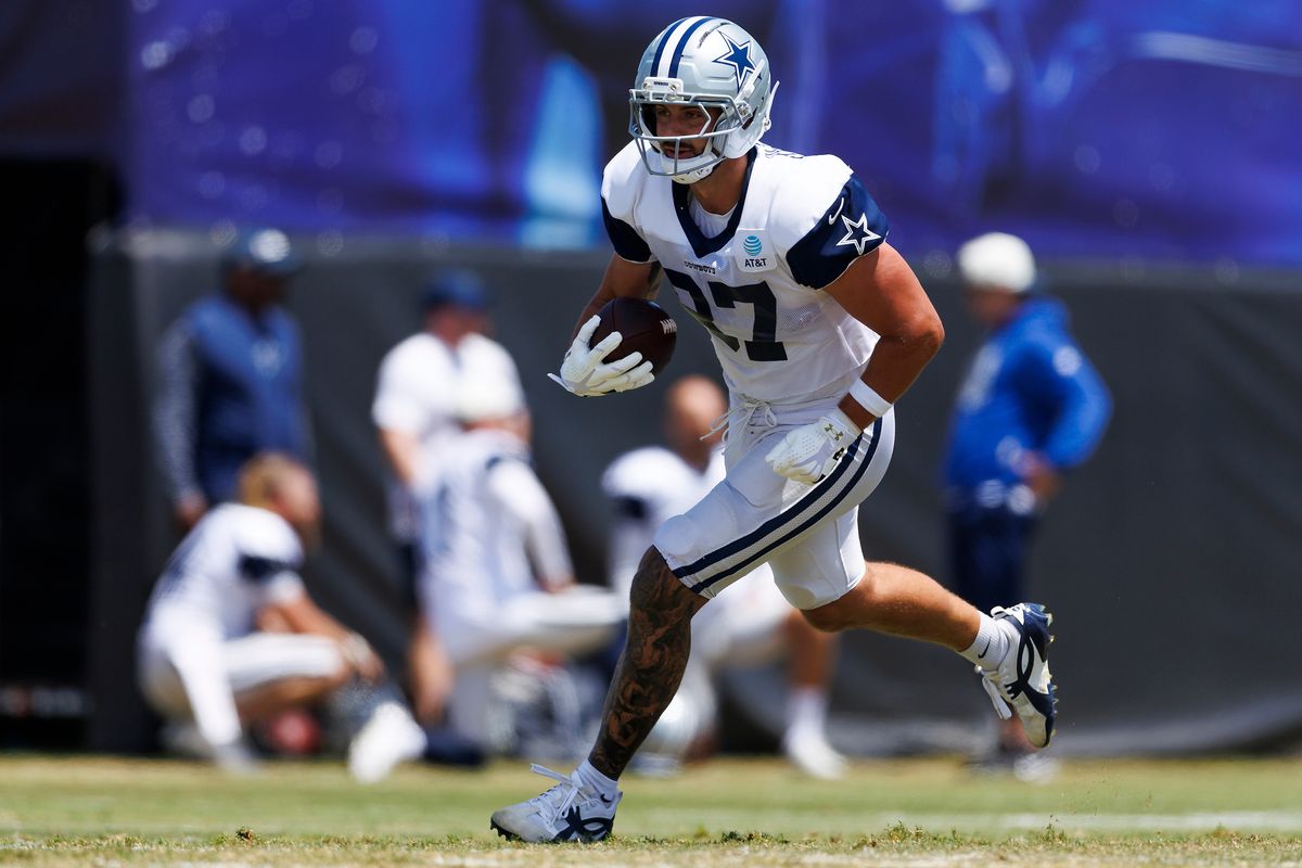 Jake Ferguson #87 of the Dallas Cowboys runs after the catch during training camp at River Ridge Playing Fields on August 4, 2026 in Oxnard, California. Jake Ferguson #87 of the Dallas Cowboys runs after the catch during training camp at River Ridge Playing Fields on August 4, 2026 in Oxnard, California.