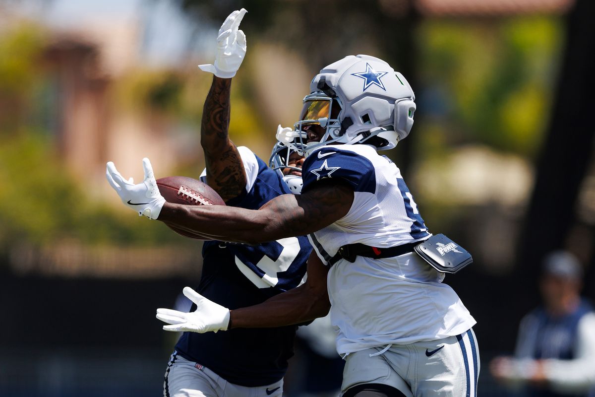 Jonathan Mingo #81 of the Dallas Cowboys catches the ball against Josh Butler #31 of the Dallas Cowboys during training camp at River Ridge Playing Fields on August 4, 2026 in Oxnard, California. Jonathan Mingo #81 of the Dallas Cowboys catches the ball against Josh Butler #31 of the Dallas Cowboys during training camp at River Ridge Playing Fields on August 4, 2026 in Oxnard, California.