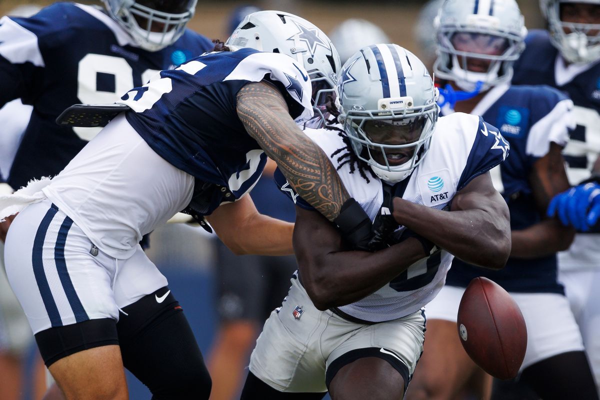 Israel Abanikanda #30 of the Dallas Cowboys fumbles the ball during training camp at River Ridge Playing Fields on August 4, 2026 in Oxnard, California. Israel Abanikanda #30 of the Dallas Cowboys fumbles the ball during training camp at River Ridge Playing Fields on August 4, 2026 in Oxnard, California.