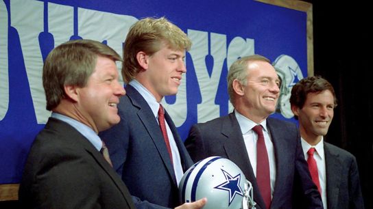 Leigh Steinberg celebrates the draft of Troy Aikman with Cowboys owner Jerry Jones and head coach Jimmy Johnson. Leigh Steinberg celebrates the draft of Troy Aikman with Cowboys owner Jerry Jones and head coach Jimmy Johnson.