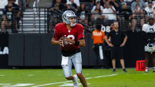 Las Vegas Raiders Quarterback Aidan O’Connell (12) looks for a Wide Receiver to make a throw during the Las Vegas Raiders Training Camp, Wednesday August 14, 2024 in Las Vegas, Nev. (DJ Cabanlong/The Sporting Tribune) Las Vegas Raiders Quarterback Aidan O’Connell (12) looks for a Wide Receiver to make a throw during the Las Vegas Raiders Training Camp, Wednesday August 14, 2024 in Las Vegas, Nev. (DJ Cabanlong/The Sporting Tribune)