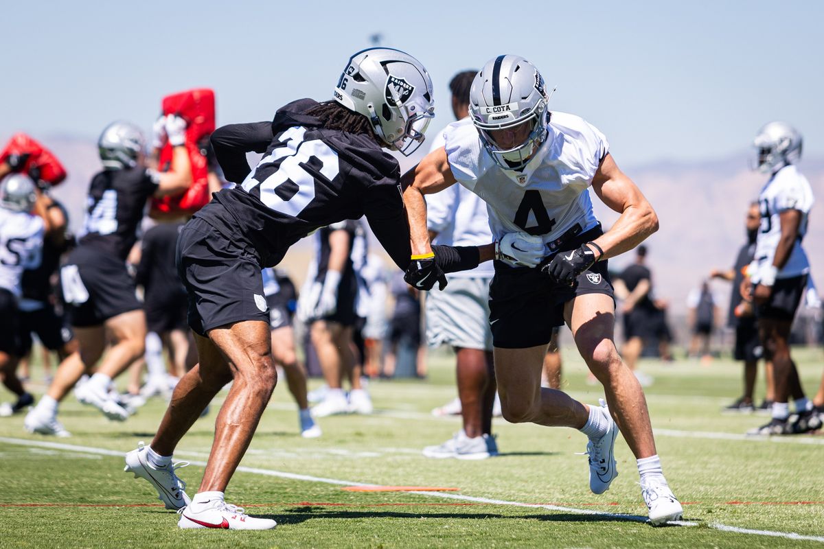 Las Vegas Raiders wide receiver Chase Cota (4) runs past corner-back Darien Porter (26) in a drill during the Raiders’ rookie mini camp, Friday May 9, 2025 in Las Vegas, Nev.
