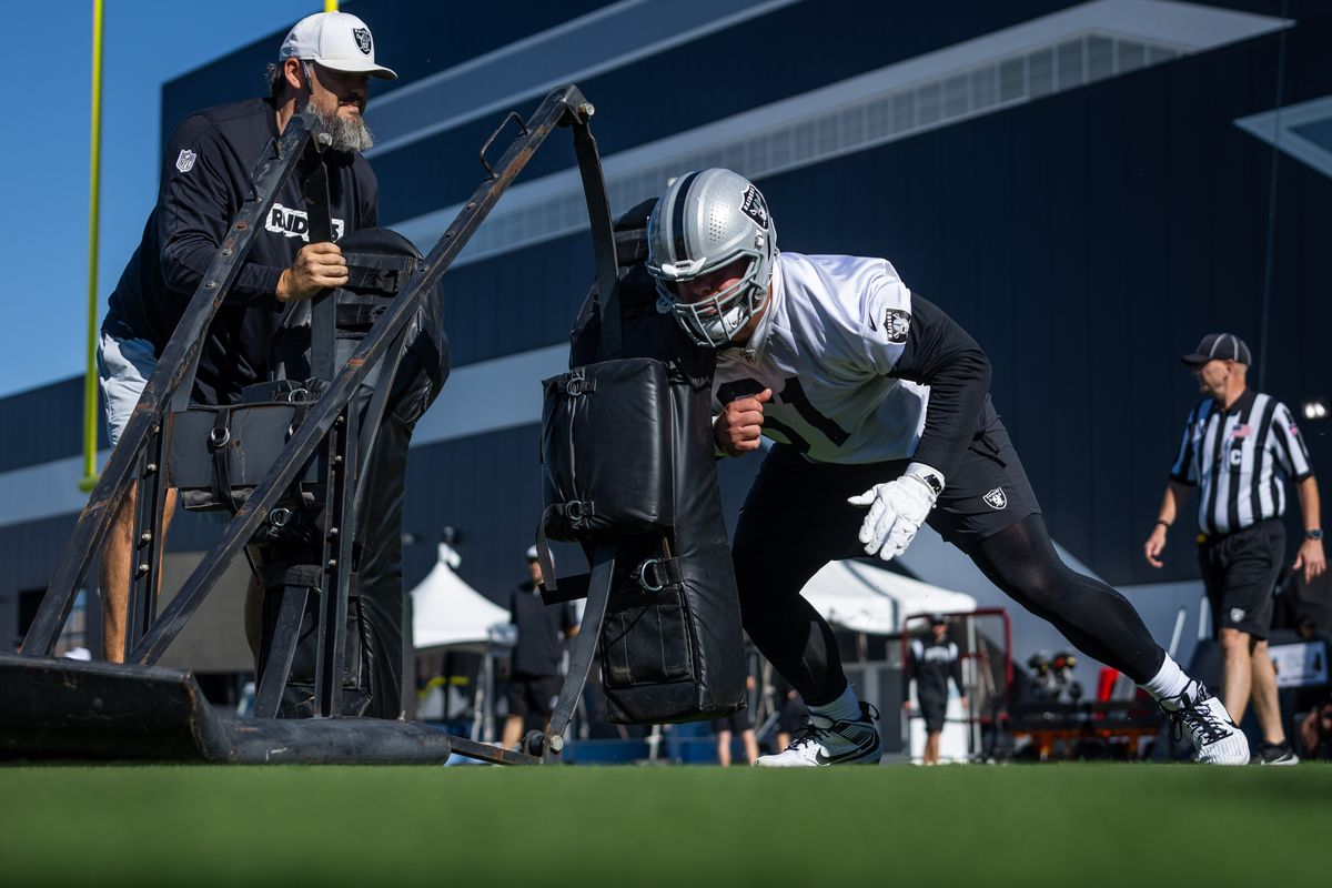  Las Vegas Raiders guard Jordan Meredith (61) hits a blocking sled in an offensive lineman drill during the Raiders Training Camp, Wednesday July 23, 2025 in Las Vegas, Nev. 