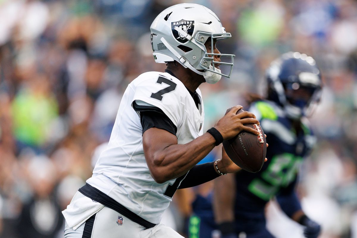 Geno Smith #7 of the Las Vegas Raiders rolls out to pass during the first half against the Seattle Seahawks at Lumen Field on August 7, 2025 in Seattle, Washington.