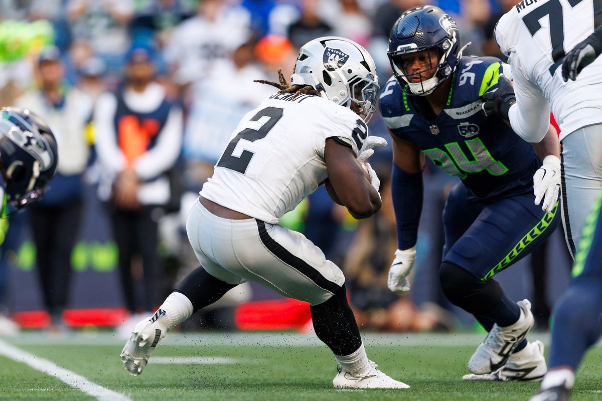 Ashton Jeanty #2 of the Las Vegas Raiders runs with the ball during the first half against the Seattle Seahawks at Lumen Field on August 7, 2025 in Seattle, Washington.