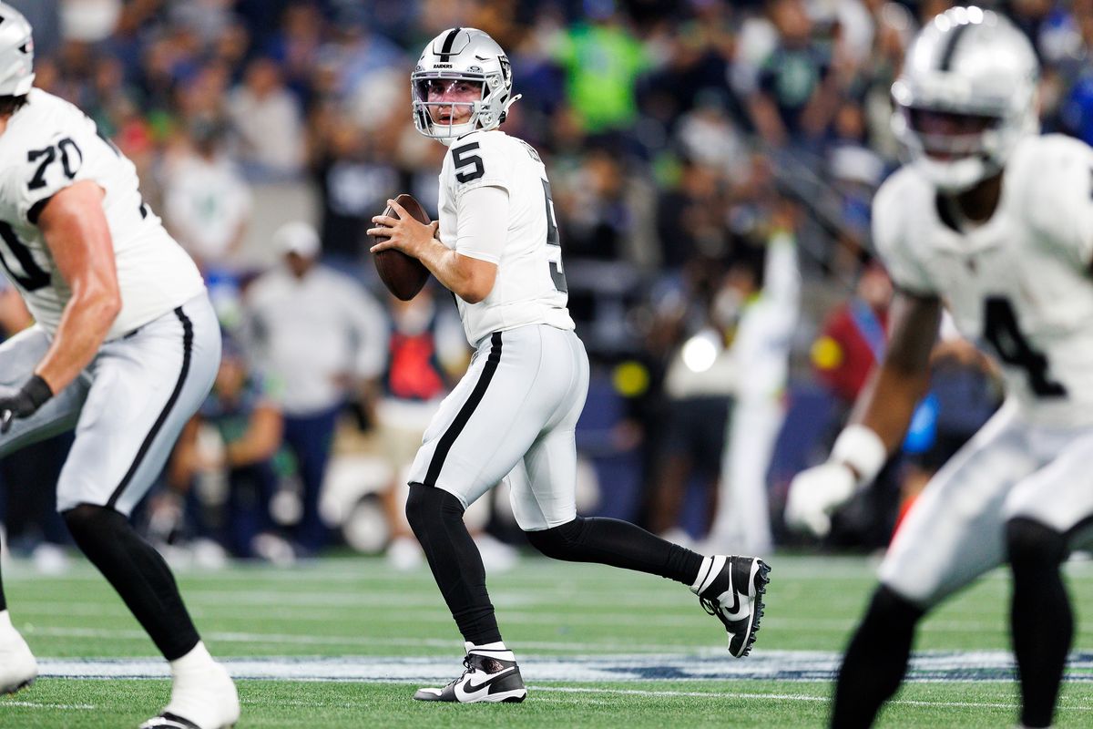 Cam Miller #5 of the Las Vegas Raiders drops back to pass during the second half against the Seattle Seahawks at Lumen Field on August 7, 2025 in Seattle, Washington.