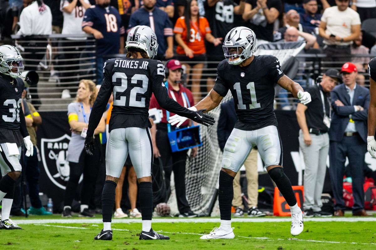 Las Vegas Raiders safety Jeremy Chinn (11) celebrates with cornerback Eric Stokes (22) after making a defensive stop during a NFL game between the Las Vegas Raiders and the Chicago Bears, Sunday September 28, 2025 in Las Vegas, Nev. Las Vegas Raiders safety Jeremy Chinn (11) celebrates with cornerback Eric Stokes (22) after making a defensive stop during a NFL game between the Las Vegas Raiders and the Chicago Bears, Sunday September 28, 2025 in Las Vegas, Nev.