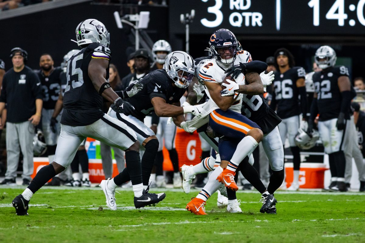 Chicago Bears wide receiver DJ Moore (2) is tackled by Las Vegas Raiders defenders during a NFL game between the Las Vegas Raiders and the Chicago Bears, Sunday September 28, 2025 in Las Vegas, Nev. Chicago Bears wide receiver DJ Moore (2) is tackled by Las Vegas Raiders defenders during a NFL game between the Las Vegas Raiders and the Chicago Bears, Sunday September 28, 2025 in Las Vegas, Nev.
