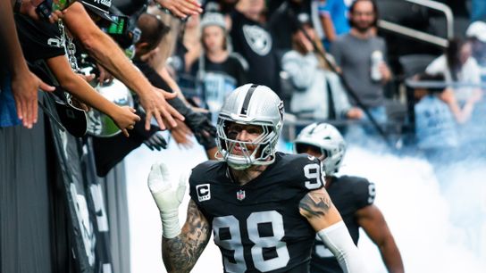 Las Vegas Raiders defensive end Maxx Crosby (98) high-fives fans before a NFL game between the Las Vegas Raiders and the Tennessee Titans, Sunday October 12, 2025 in Las Vegas, Nev.