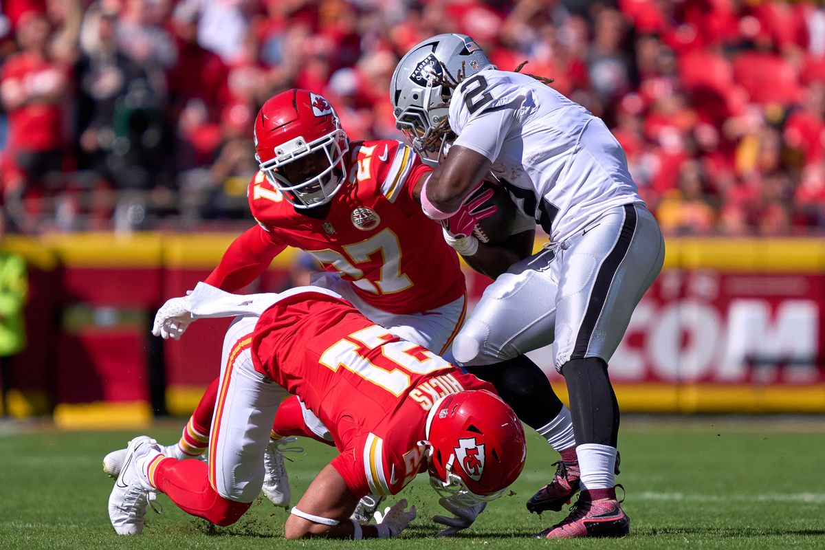 Las Vegas Raiders running back Ashton Jeanty #2 battles with Kansas City Chiefs defensive back Chamarri Conner #27 and safety Jaden Hicks #21 in the second half against the Kansas City Chiefs during an NFL game at Arrowhead Stadium on October 19, 2025 in Kansas City, Missouri. Las Vegas Raiders running back Ashton Jeanty #2 battles with Kansas City Chiefs defensive back Chamarri Conner #27 and safety Jaden Hicks #21 in the second half against the Kansas City Chiefs during an NFL game at Arrowhead Stadium on October 19, 2025 in Kansas City, Missouri.