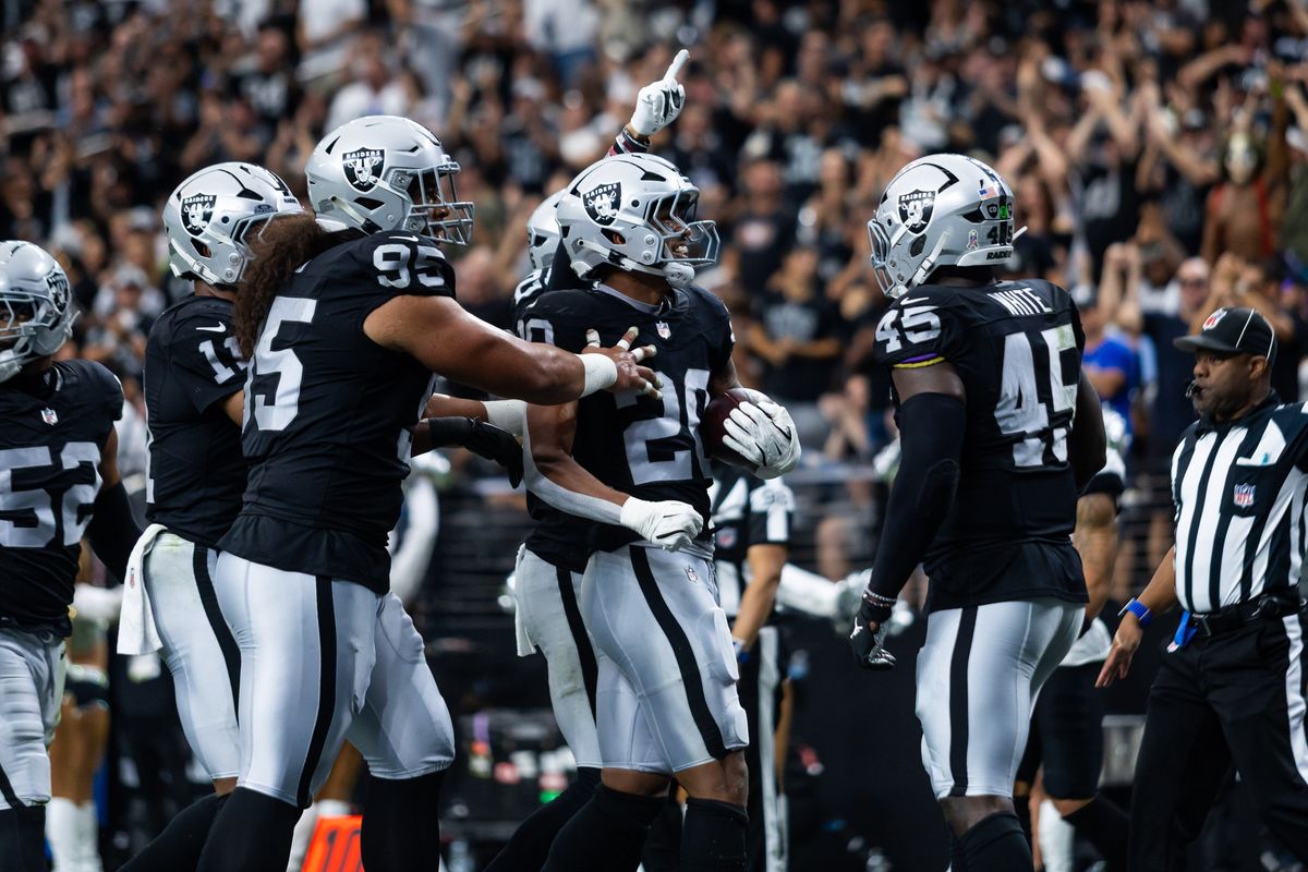 Las Vegas Raiders defenders celebrate after making an interception during a NFL game between the Las Vegas Raiders and the Jacksonville Jaguars, Sunday November 2, 2025 in Las Vegas, Nev.