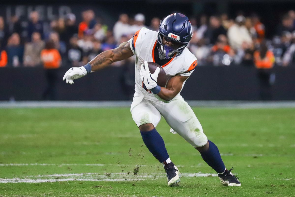 Broncos running back RJ Harvey (12) takes the ball downfield during thrid quarter of NFL game against the Raiders on Sunday, Dec. 7, 2025 at Allegiant Stadium in Las Vegas.