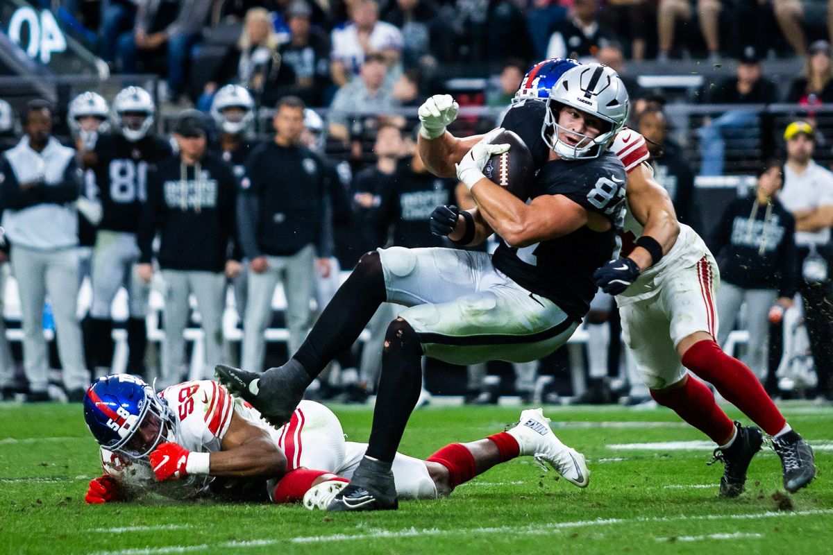 Las Vegas Raiders tight-end Michael Mayer (87) makes a reception and is tackled during a NFL game between the Las Vegas Raiders and the New York Giants, Sunday December 28, 2025 in Las Vegas, Nev.