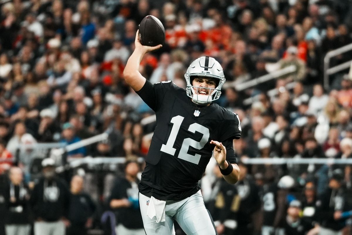 Raiders quarterback Aidan O’Connell (12) passes the ball downfield  during first half of NFL game against Chiefs on Sunday, January 4, 2026 at Allegiant Stadium in Las Vegas.    