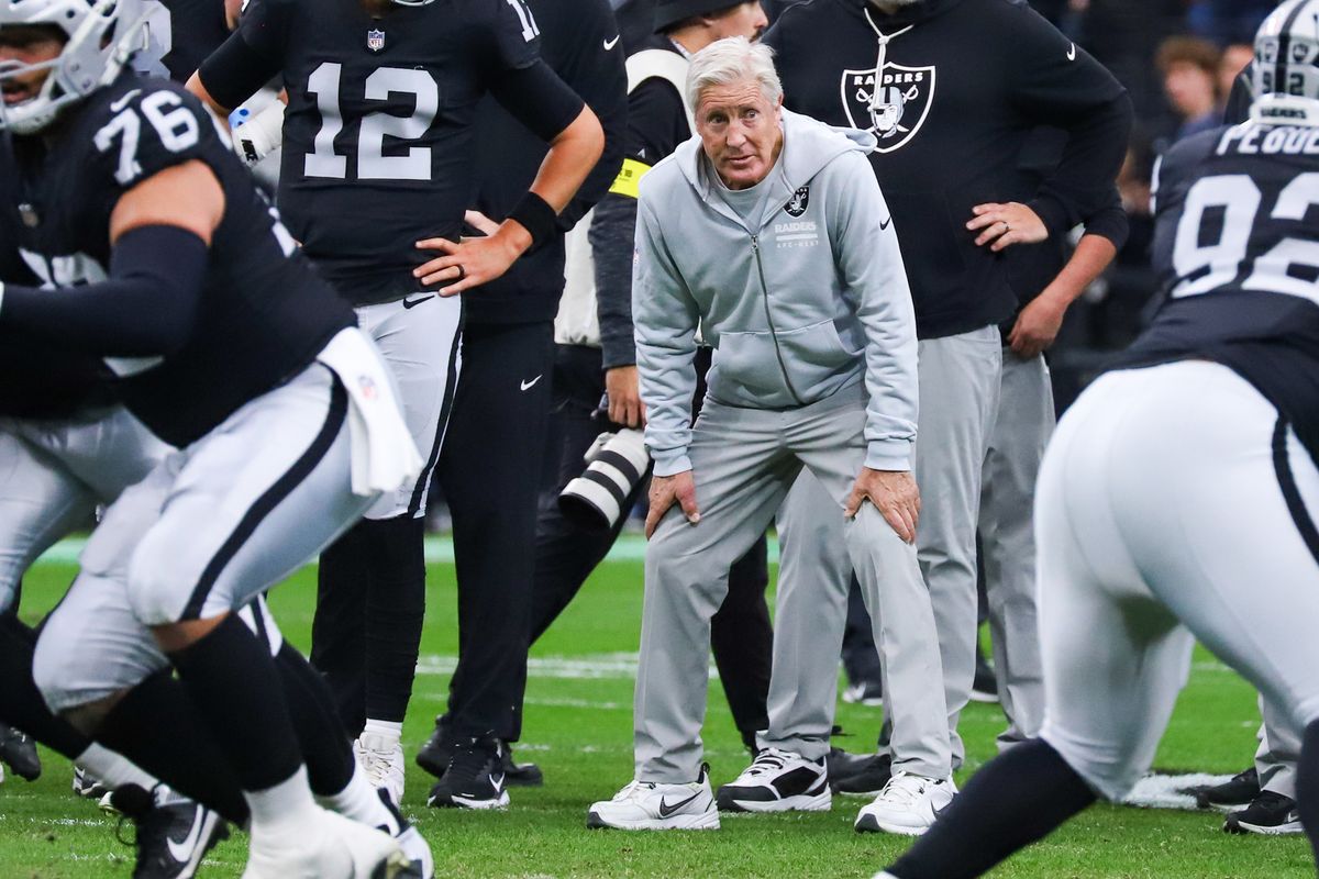 Raiders coach Pete Carol examines his team during warmups prior to NFL game against Chiefs on Sunday, January 4, 2026 at Allegiant Stadium in Las Vegas.
