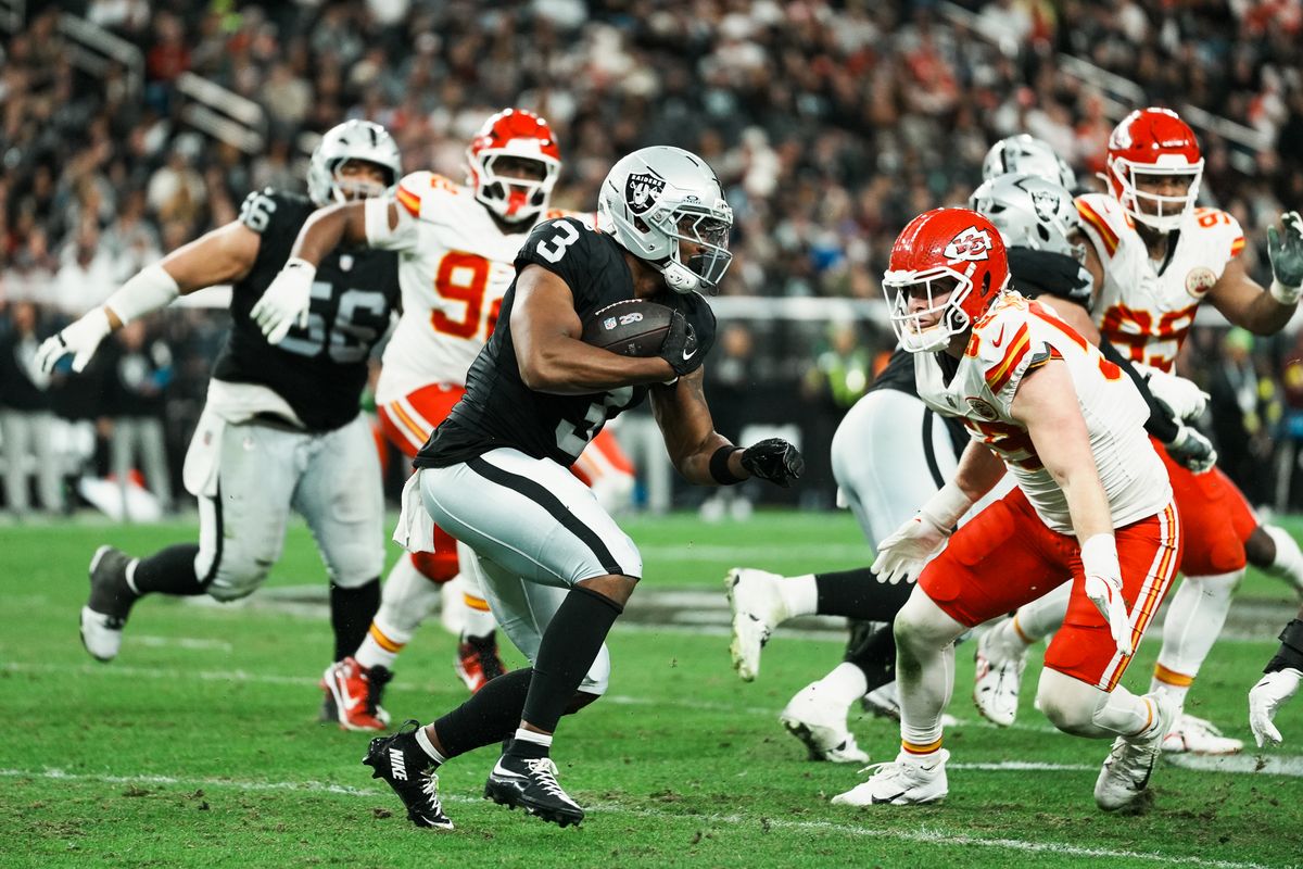 Raiders running back Zamir White (3) carries the ball downfield during second half of  NFL game against Chiefs on Sunday, January 4, 2026 at Allegiant Stadium in Las Vegas.