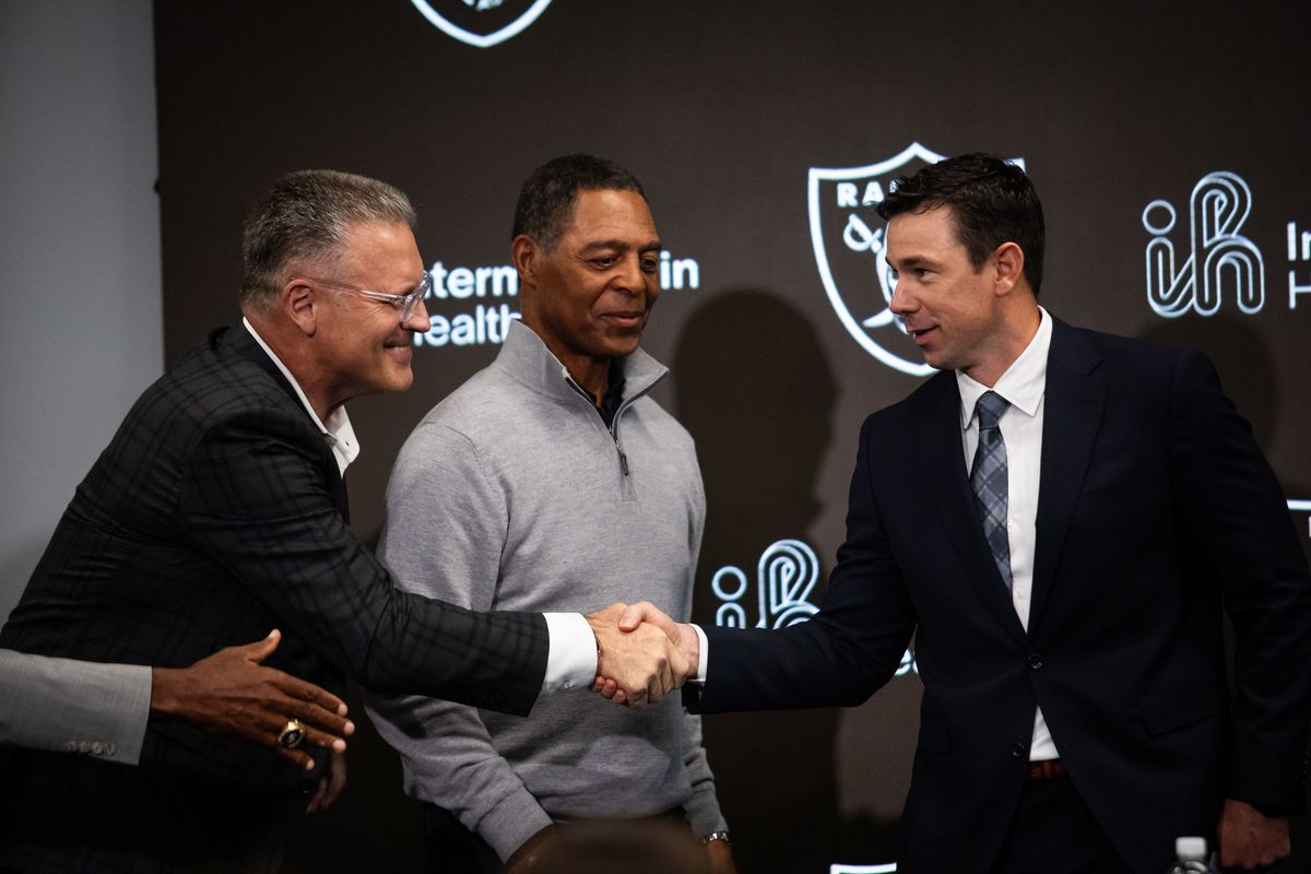 Former Las Vegas Raiders defensive end Howie Long shakes the hand of the newly hired head coach Klint Kubiak during a press conference, Tuesday February 10, 2026 in Henderson, Nev. 