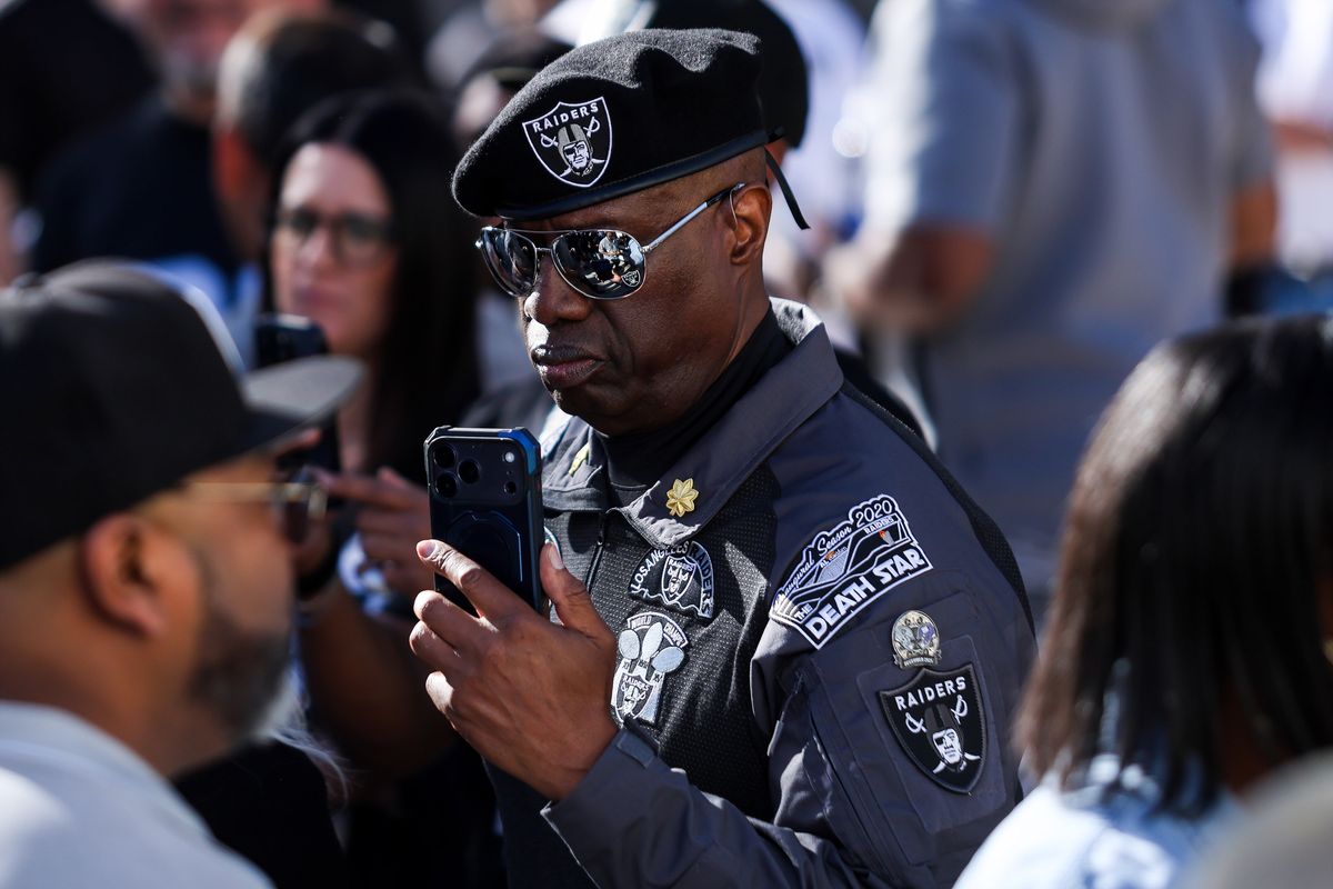 Las Vegas Raiders fan wearing Raiders apparel and commemorative patches at Raiders 2026 Draft Party at Palms Casino Resort, Thursday April 23, 2026 in Las Vegas, Nev. 