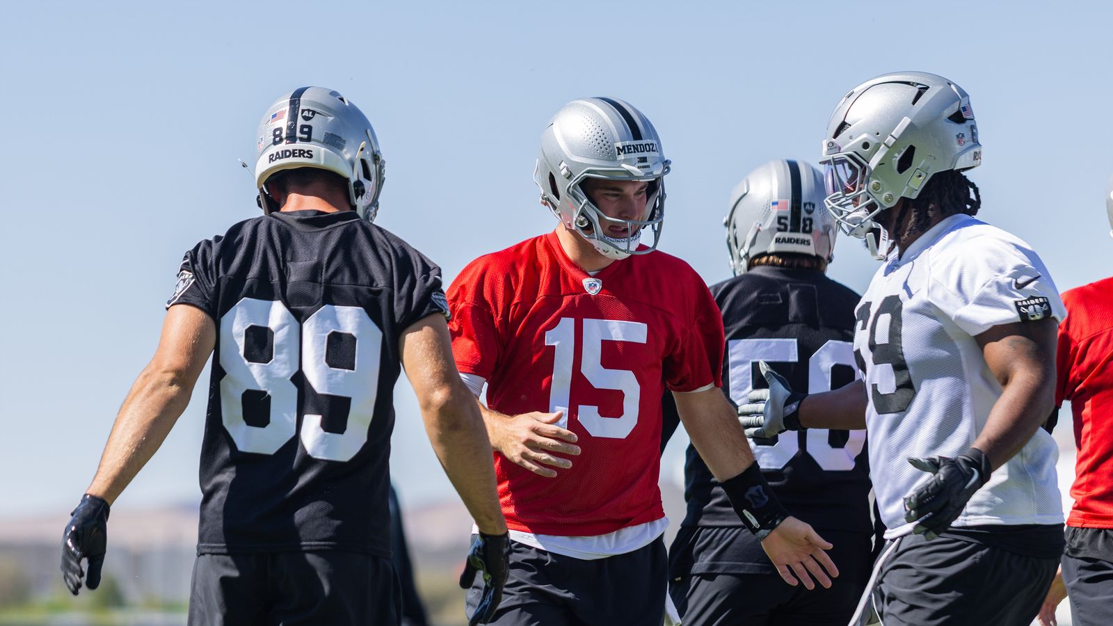 Las Vegas Raiders quarterback Fernando Mendoza (15) high-fives teammates during Raiders OTAs at Intermountain Health Performance Center, Wednesday May 20, 2026 in Henderson, Nev. Las Vegas Raiders quarterback Fernando Mendoza (15) high-fives teammates during Raiders OTAs at Intermountain Health Performance Center, Wednesday May 20, 2026 in Henderson, Nev.