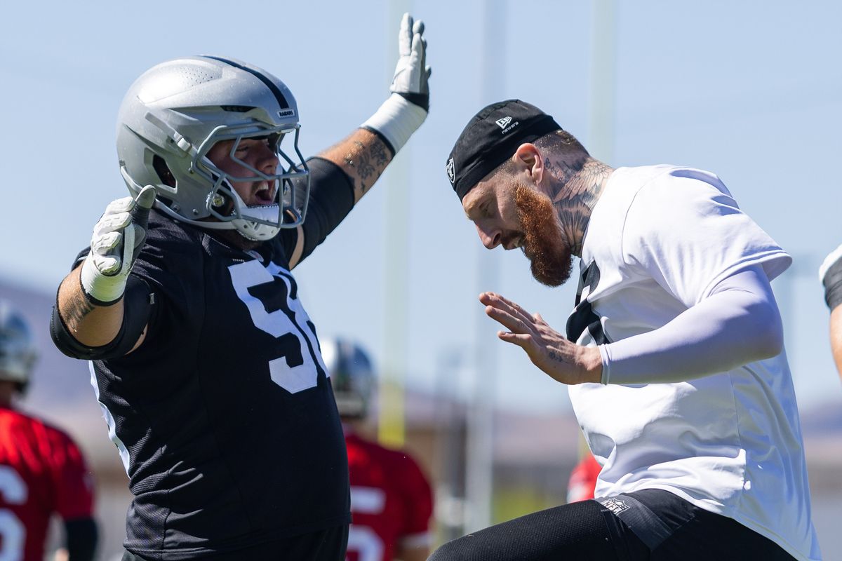 Las Vegas Raiders offensive-guard Jackson Powers-Johnson (58) and defensive-end Maxx Crosby (98) do a handshake during Raiders OTAs at Intermountain Health Performance Center, Thursday May 28, 2026 in Henderson, Nev. Las Vegas Raiders offensive-guard Jackson Powers-Johnson (58) and defensive-end Maxx Crosby (98) do a handshake during Raiders OTAs at Intermountain Health Performance Center, Thursday May 28, 2026 in Henderson, Nev.