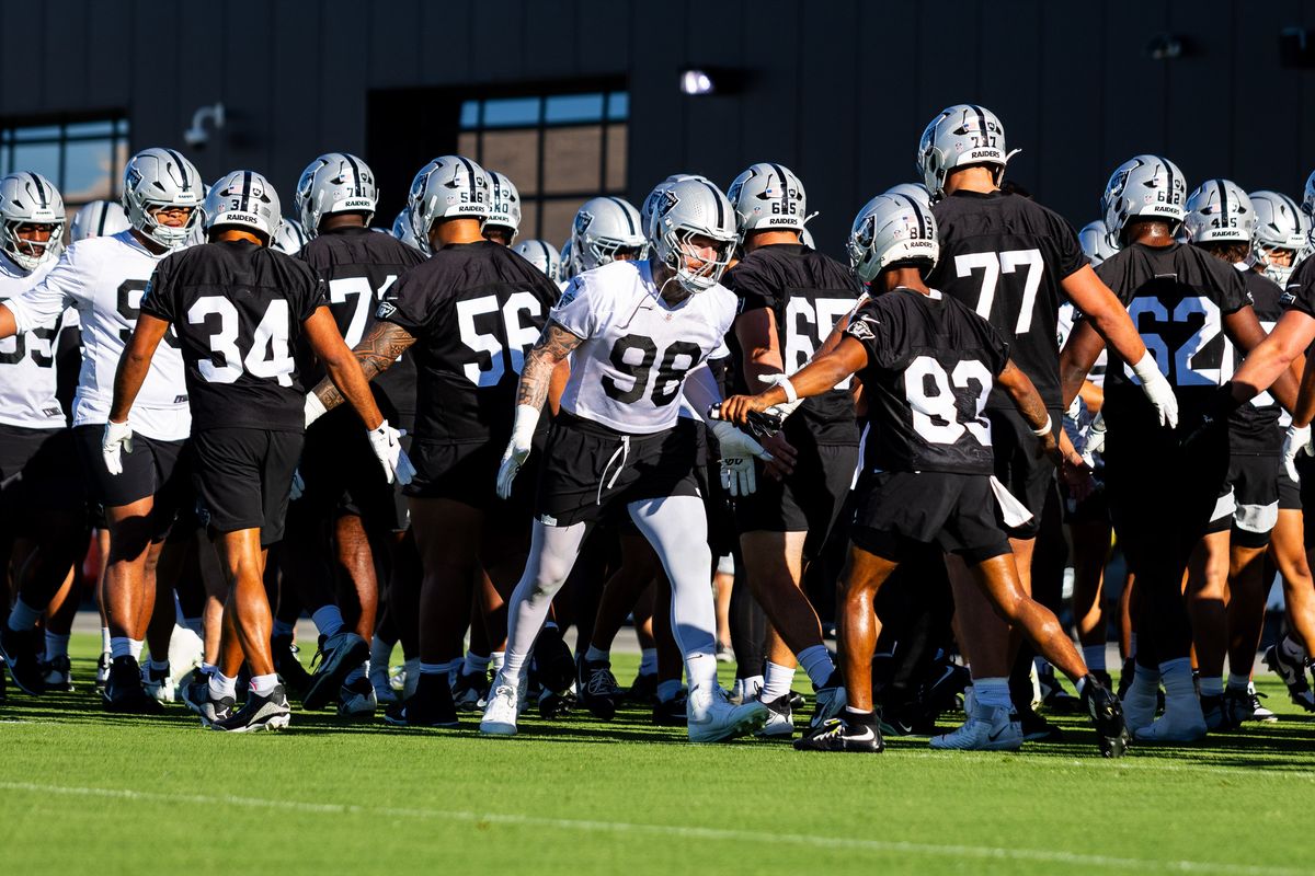 Las Vegas Raiders high-five one another before Raiders Training Camp at Intermountain Health Performance Center, Thursday July 30, 2026 in Henderson, Nev. Las Vegas Raiders high-five one another before Raiders Training Camp at Intermountain Health Performance Center, Thursday July 30, 2026 in Henderson, Nev.