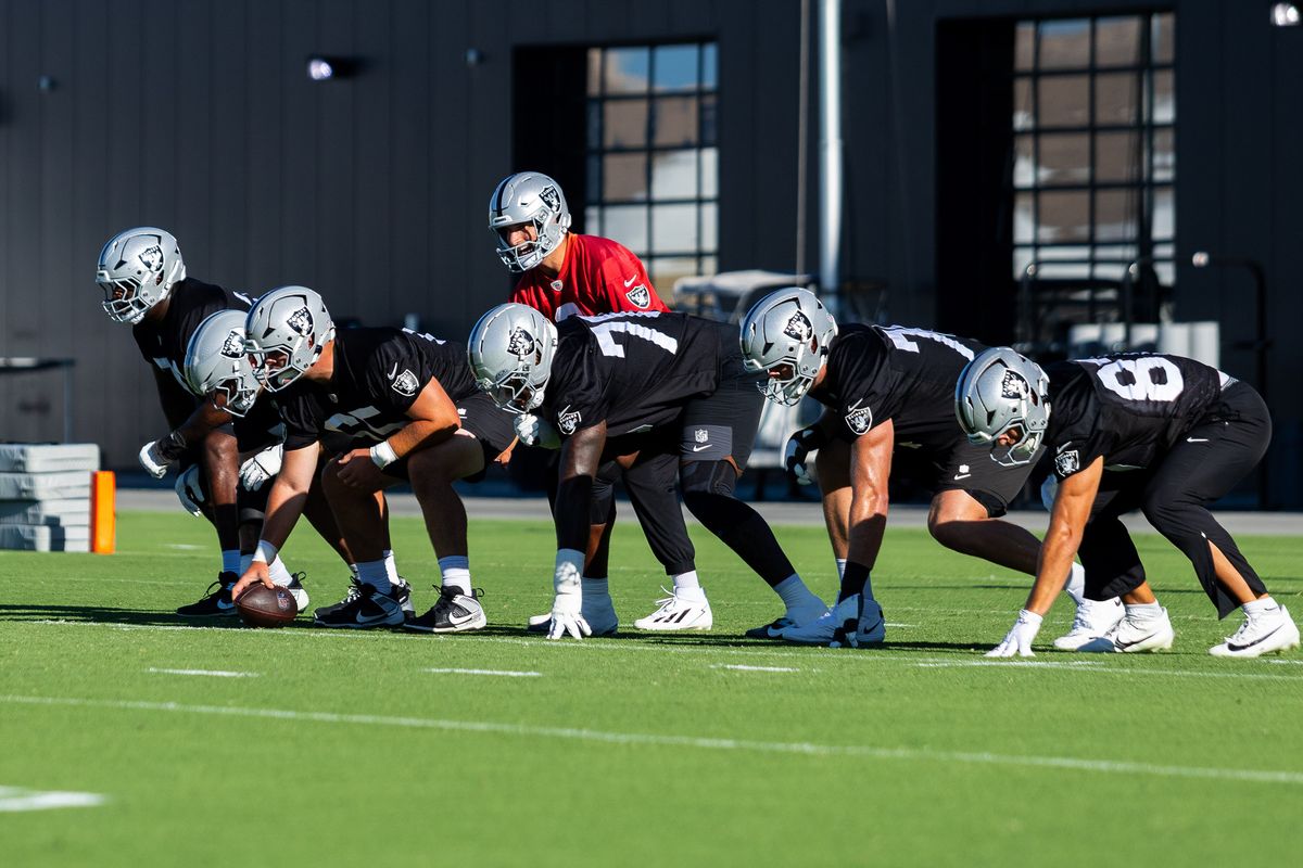 Las Vegas Raiders quarterback Kirk Cousins (8) goes under center during an offensive drill during Raiders Training Camp at Intermountain Health Performance Center, Thursday July 30, 2026 in Henderson, Nev. Las Vegas Raiders quarterback Kirk Cousins (8) goes under center during an offensive drill during Raiders Training Camp at Intermountain Health Performance Center, Thursday July 30, 2026 in Henderson, Nev.
