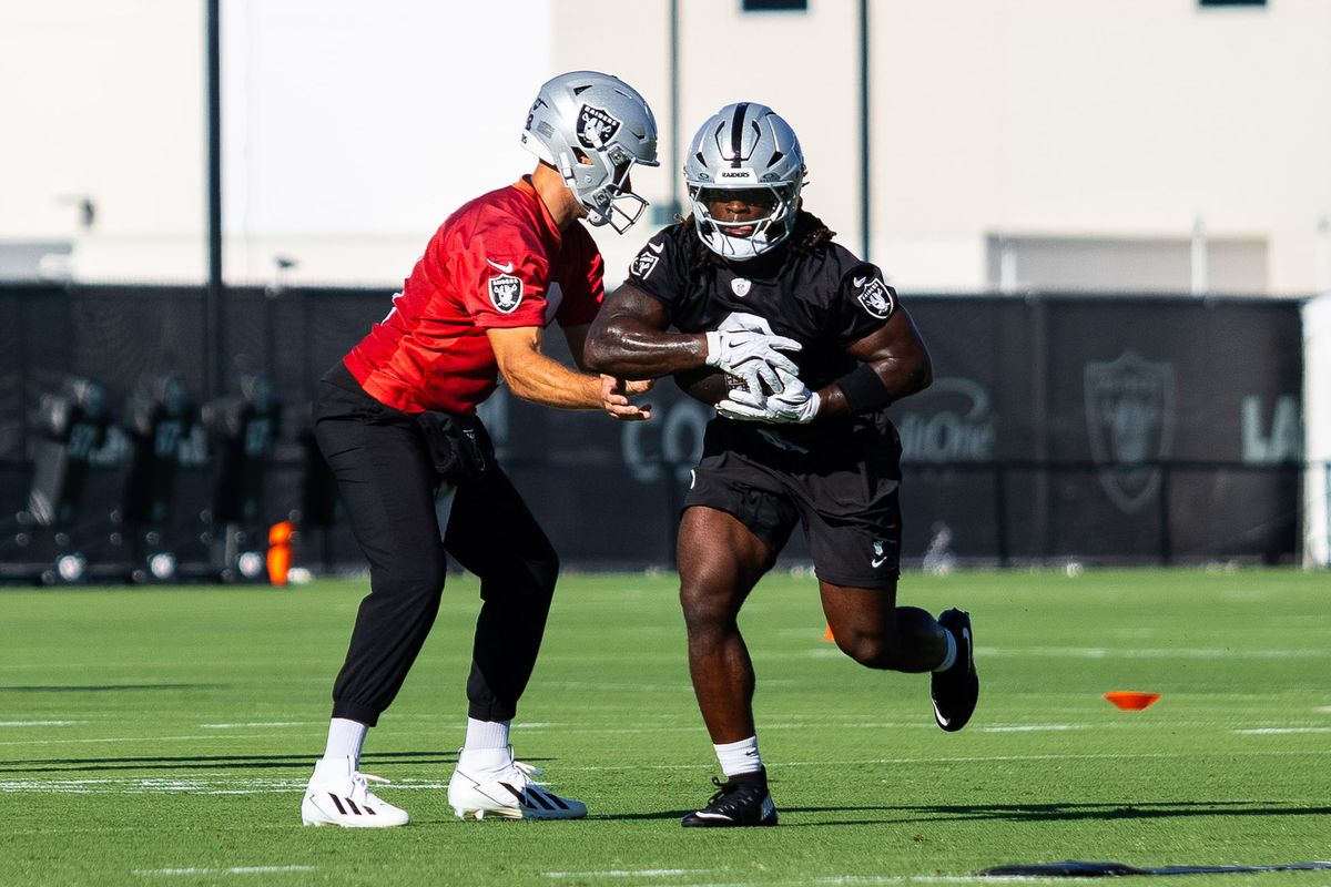 Las Vegas Raiders quarterback Kirk Cousins (8) hands the ball to running back Ashton Jeanty (2) during Raiders Training Camp at Intermountain Health Performance Center, Thursday July 30, 2026 in Henderson, Nev. Las Vegas Raiders quarterback Kirk Cousins (8) hands the ball to running back Ashton Jeanty (2) during Raiders Training Camp at Intermountain Health Performance Center, Thursday July 30, 2026 in Henderson, Nev.