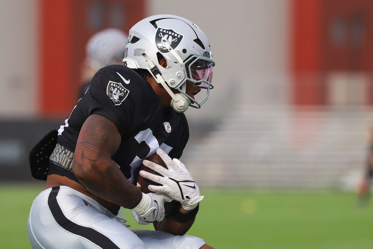 Las Vegas Raiders running back Mike Washington Jr. (30) runs with the ball during Raiders Training Camp at Intermountain Health Performance Center, Monday Aug. 10, 2026 in Henderson, Nev. Las Vegas Raiders running back Mike Washington Jr. (30) runs with the ball during Raiders Training Camp at Intermountain Health Performance Center, Monday Aug. 10, 2026 in Henderson, Nev.