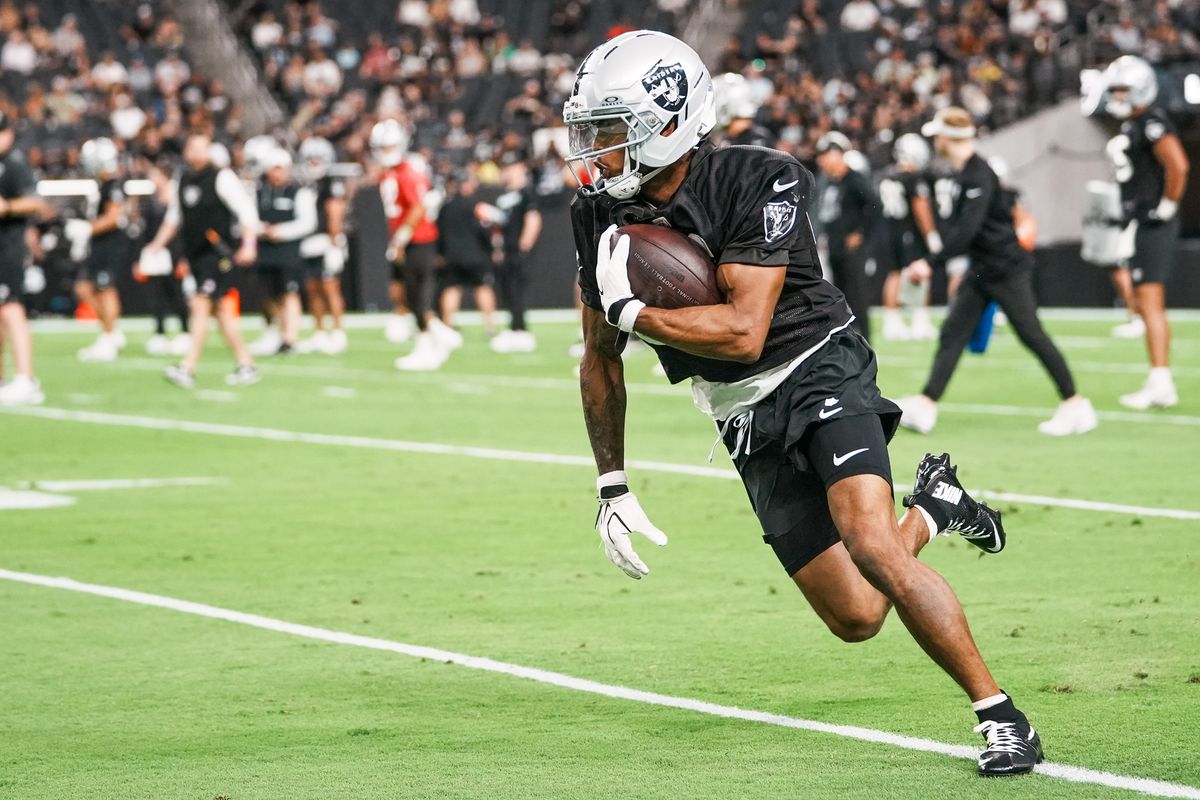 Las Vegas Raiders wide receiver Deven Thompkins (83) runs with the ball during Raiders practice at Allegiant Stadium, Tuesday Aug. 11, 2026 in Las Vegas, Nev. Las Vegas Raiders wide receiver Deven Thompkins (83) runs with the ball during Raiders practice at Allegiant Stadium, Tuesday Aug. 11, 2026 in Las Vegas, Nev.