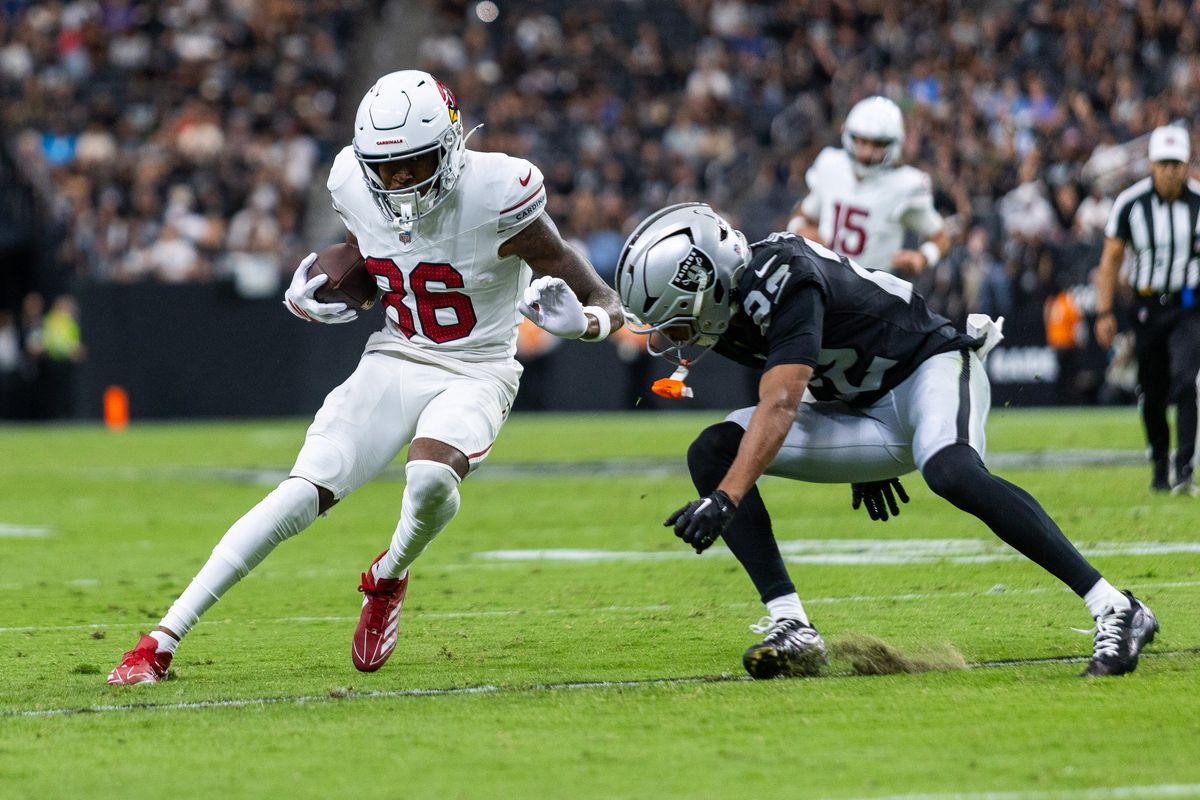Arizona Cardinals wide receiver Jalen Brooks (86) brushes off Las Vegas Raiders cornerback Greedy Vance (22) while running with the ball during a NFL Preseason game between the Las Vegas Raiders and the Arizona Cardinals at Allegiant Stadium, Thursday August 13, 2026 in Las Vegas, Nev. Arizona Cardinals wide receiver Jalen Brooks (86) brushes off Las Vegas Raiders cornerback Greedy Vance (22) while running with the ball during a NFL Preseason game between the Las Vegas Raiders and the Arizona Cardinals at Allegiant Stadium, Thursday August 13, 2026 in Las Vegas, Nev.