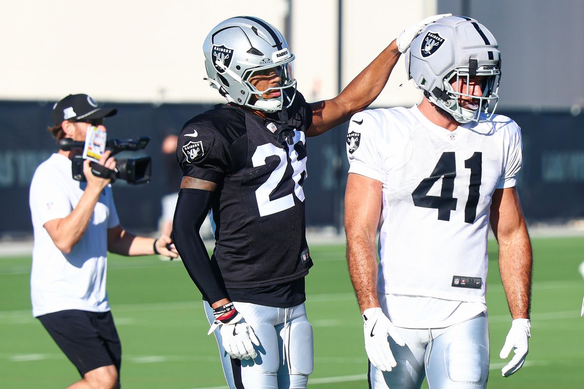Las Vegas Raiders CB Darien Porter (26) pats his teammate TE Chris Myarick (41) on the head during drills on Day 13 of Raiders Training Camp at Intermountain Health Performance Center on Sunday, August 16, 2026, in Henderson, Nevada. Las Vegas Raiders CB Darien Porter (26) pats his teammate TE Chris Myarick (41) on the head during drills on Day 13 of Raiders Training Camp at Intermountain Health Performance Center on Sunday, August 16, 2026, in Henderson, Nevada.