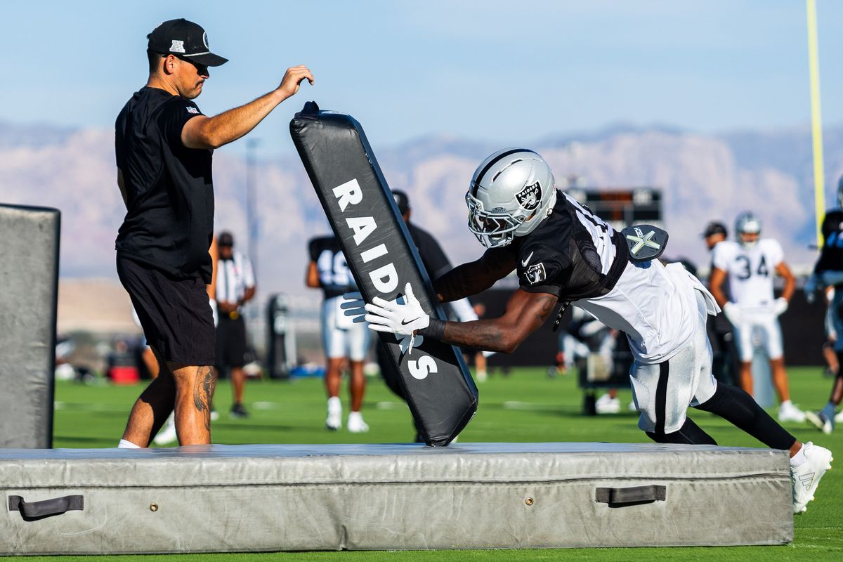Las Vegas Raiders safety Devin Lafayette (40) tackles a pad in a special teams drill during Raiders Training Camp at Intermountain Health Performance Center, Monday August 17, 2026 in Henderson, Nev.