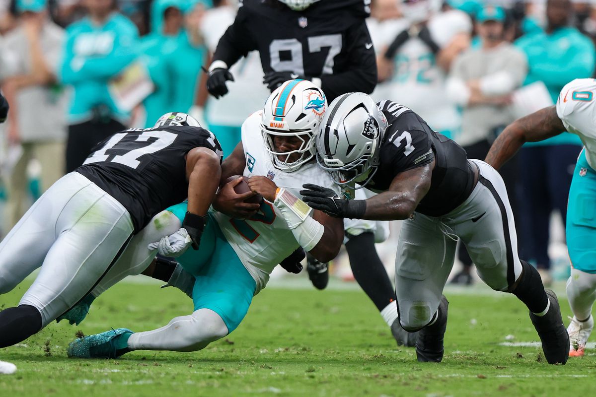 Las Vegas Raiders linebacker Quay Walker (7) and Las Vegas Raiders linebacker Nakobe Dean (17) tackle Miami Dolphins quarterback Malik Willis (2) during a NFL regular season game between the Las Vegas Raiders and Miami Dolphins at Allegiant Stadium, Sunday September 13, 2026 in Las Vegas, NV. Las Vegas Raiders linebacker Quay Walker (7) and Las Vegas Raiders linebacker Nakobe Dean (17) tackle Miami Dolphins quarterback Malik Willis (2) during a NFL regular season game between the Las Vegas Raiders and Miami Dolphins at Allegiant Stadium, Sunday September 13, 2026 in Las Vegas, NV.