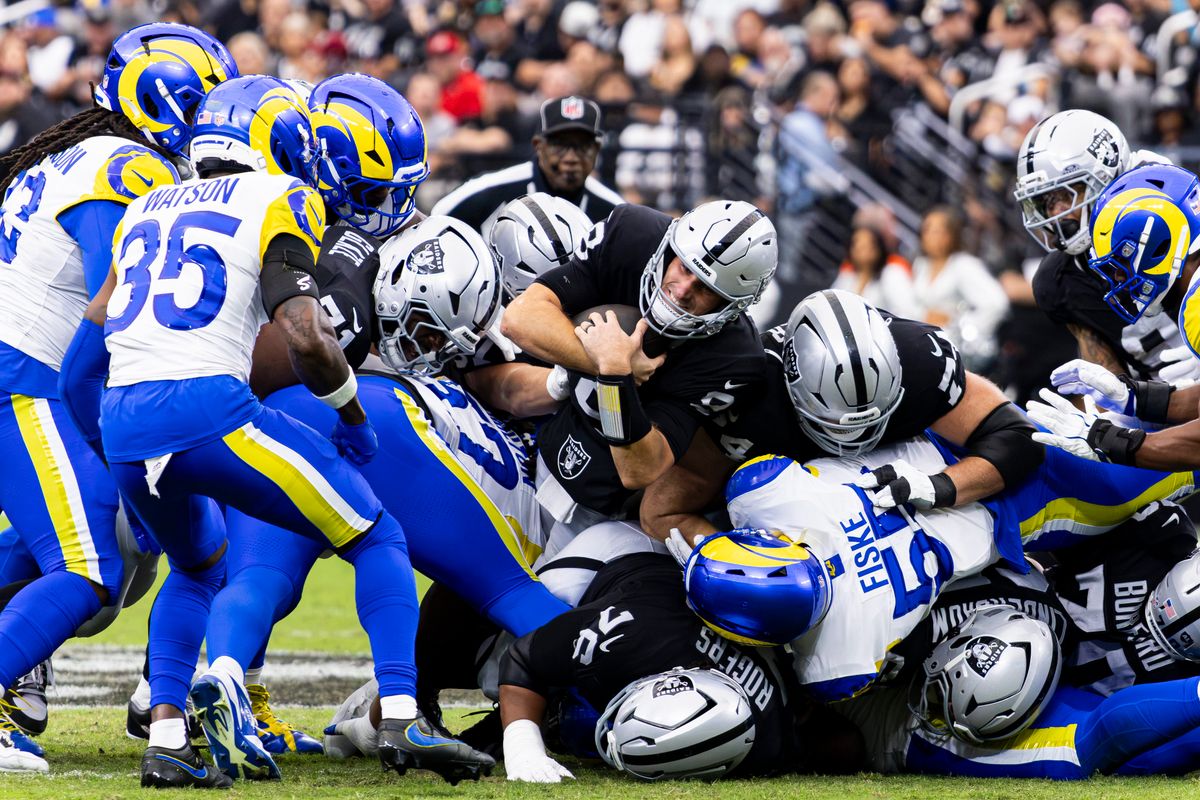 Las Vegas Raiders QB Kirk Cousins (8) dives for a first down in the first quarter of a game against the Los Angeles Rams on Sunday, October 25, 2026, at Allegiant Stadium in Las Vegas, Nevada.