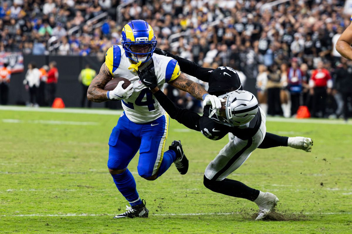 Las Vegas Raiders S Treydan Stukes (31) pulls Los Angeles Rams RB Blake Corum by the collar resulting in a penalty flag in the fourth quarter of the game on Sunday, October 25, 2026, at Allegiant Stadium in Las Vegas, Nevada.