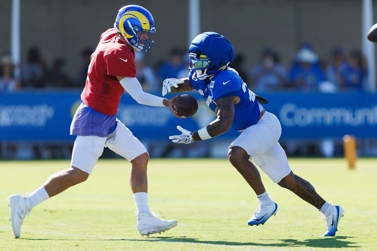 Matthew Stafford #9 of the Los Angeles Rams hands off to Kyren Williams #23 of the Los Angeles Rams during training camp at Loyola Marymount University on August 1, 2026 in Los Angeles, California. Matthew Stafford #9 of the Los Angeles Rams hands off to Kyren Williams #23 of the Los Angeles Rams during training camp at Loyola Marymount University on August 1, 2026 in Los Angeles, California.
