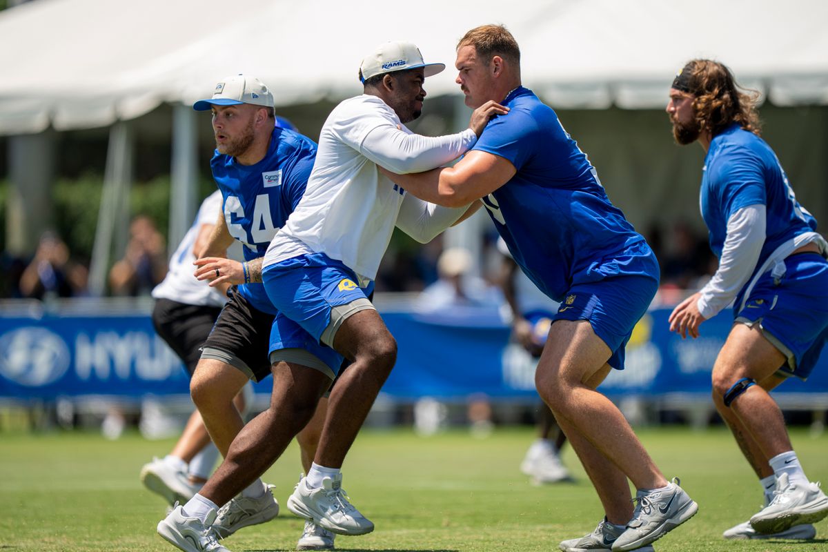 Keir Thomas II #11 pass rushing Bryce Henderson #70 of the Los Angeles Rams during Rams training camp at Loyola Marymount University on Sunday, August 2nd in Westchester, CA.