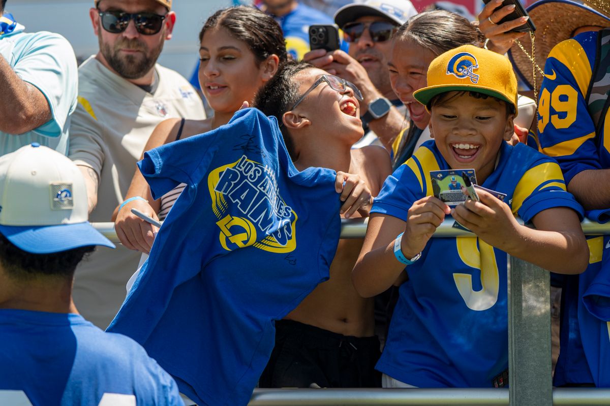 Blake Corum #24 of the Los Angeles Rams signing autographs during Rams training camp at Loyola Marymount University on Sunday, August 2nd in Westchester, CA.