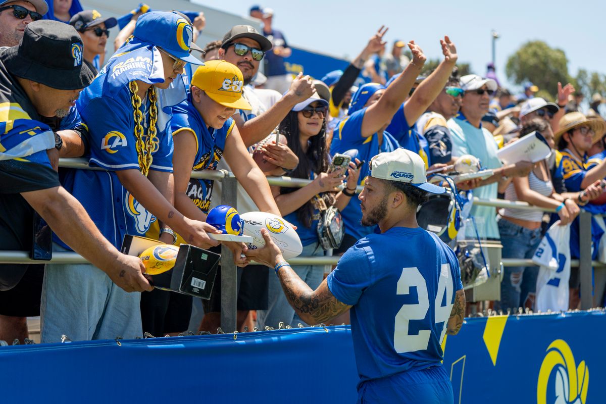 Blake Corum #24 of the Los Angeles Rams signing autographs during Rams training camp at Loyola Marymount University on Sunday, August 2nd in Westchester, CA.